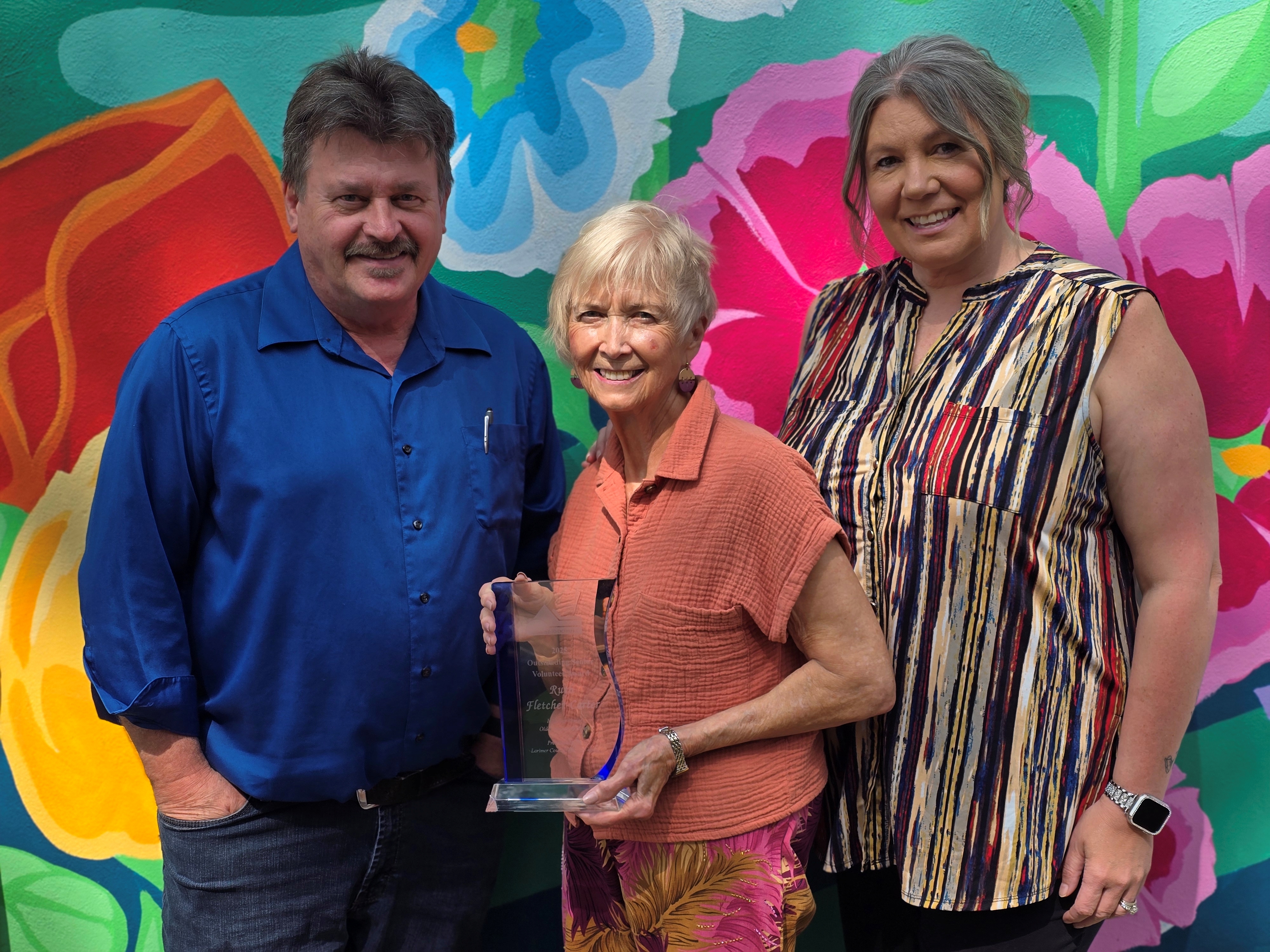 Image Ruth Fletcher-Carter accepts her Outstanding Senior Volunteer Award with nominator Steven Conaway and Office on Aging Program Manager Erin Alt.