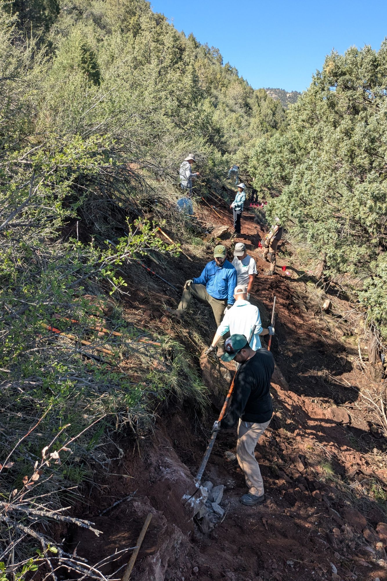 Image A crew from Volunteers for Outdoor Colorado work on some of the final portions of the trail in Spring 2025.