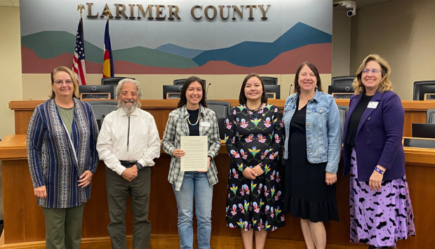 Larimer County Commissioners and staff pose with community members for Indigenous Peoples Day proclamation