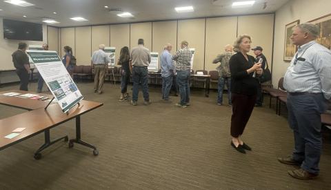 Staff and Public Engaging with Posters for the Draft Plan Open House