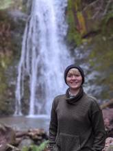 Kiera Denehan posed in front of waterfall